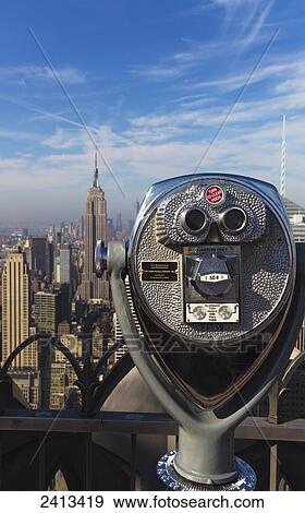 Stock Photo - View of the Empire State Building and Manhattan from the Top of the Rock Observation Tower at the Rockefeller Center; New York City, New York, United States of America. Fotosearch
