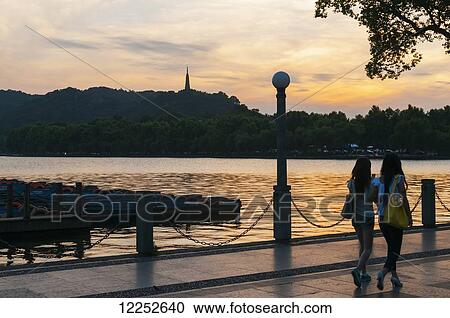 View of the famous West Lake; Hangzhou, Zhejiang, China View Large Photo Image Stock Image - View of the famous West Lake; Hangzhou, Zhejiang, China. Fotosearch