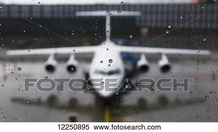 View of the front of an aircraft through a wet window; Munich, Germany View Large Photo Image Stock Photography - View of the front of an aircraft through a wet window; Munich, Germany. Fotosearch