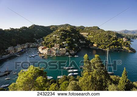 View of the harbour and buildings along the coast; Portofino, Liguria, Italy View Large Photo Image Picture - View of the harbour and buildings along the coast; Portofino, Liguria, Italy. Fotosearch
