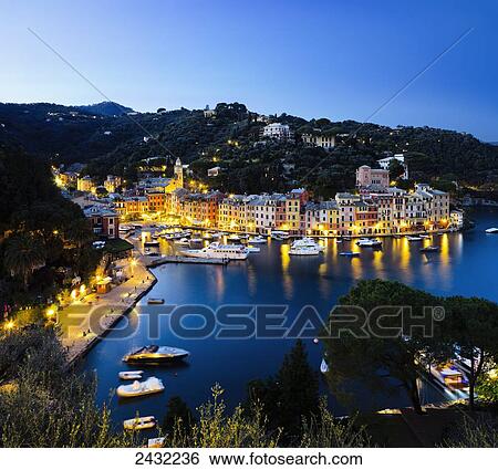 Stock Photograph - View of the harbour at dusk; Portofino, Liguria, Italy. Fotosearch