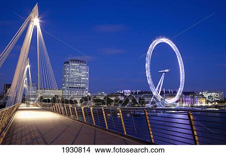 Picture - View of the London Eye from the Hungerford Bridge, River Thames, London, England, London, England.. Fotosearch