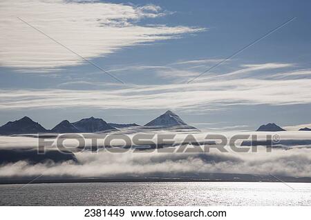View of the low clouds along the coastline of Svalbard; Svalbard, Norway View Large Photo Image Stock Photo - View of the low clouds along the coastline of Svalbard; Svalbard, Norway. Fotosearch