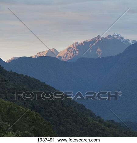 Stock Image - View Of The Mountains In Sunlight; Trongsa District Bhutan. Fotosearch