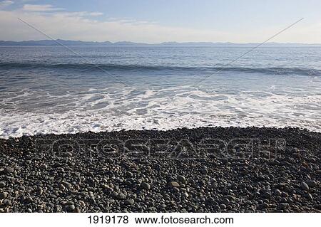 View Of The Olympic Mountains From The Juan De Fuca Marine Trail; Mystic Beach, Vancouver Island, British Columbia, Canada View Large Photo Image Stock Photo - View Of The Olympic Mountains From The Juan De Fuca Marine Trail; Mystic Beach, Vancouver Island, British Columbia, Canada. Fotosearch