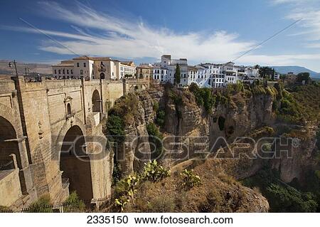 Stock Image - View Of The Roman Bridge And The Rest Of Ronda; Ronda, Spain. Fotosearch