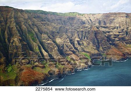 Picture - View of the rugged coastline along a hawaiian island, Na Pali coast; Kauai, Hawaii, United States of America. Fotosearch