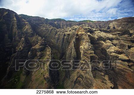 View of the rugged landscape on an hawaiian island, Na Pali coast; Kauai, Hawaii, United States of America View Large Photo Image Stock Photo - View of the rugged landscape on an hawaiian island, Na Pali coast; Kauai, Hawaii, United States of America. Fotosearch