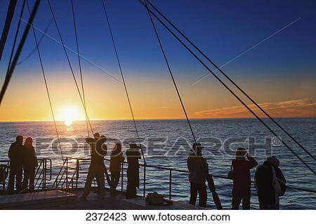Stock Image - View Of The Sunset In The Remote Area Of Doubtful Sound From A Boat; New Zealand. Fotosearch