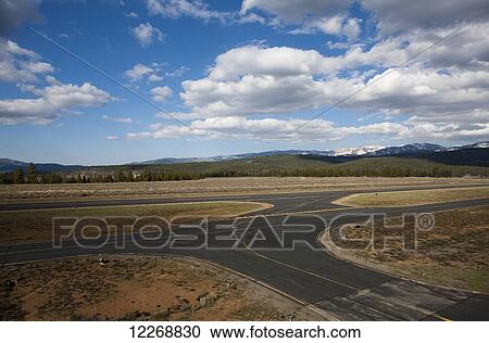 Stock Image - View of the taxi way and runway at the Truckee Tahoe Airport, California, USA. Fotosearch