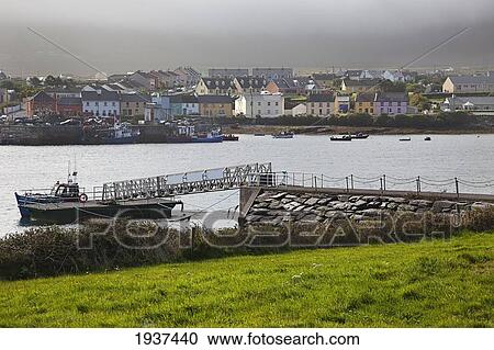 Stock Image - View Of The Town Along A River; Portmagee County Kerry Ireland. Fotosearch