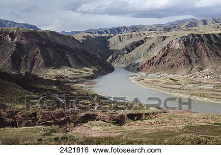 View of Tibetan mountains and Yellow River (Huang He) near Lajiaxiang city; Qinghai province, Tibet View Large Photo Image Stock Photograph - View of Tibetan mountains and Yellow River (Huang He) near Lajiaxiang city; Qinghai province, Tibet. Fotosearch
