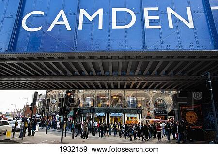 Stock Photo - View Of Tourists From Under The Bridge In Camden Town, North London, Lonoon, Uk. Fotosearch