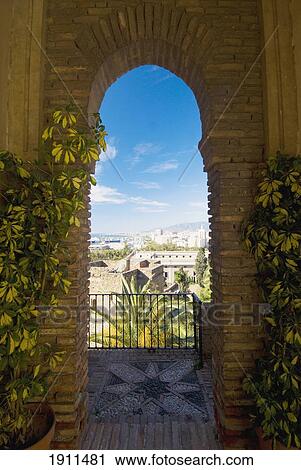 View Of Town Through Arched Window Of Alcazaba, Malaga, Andalucia, Spain View Large Photo Image Stock Image - View Of Town Through Arched Window Of Alcazaba, Malaga, Andalucia, Spain. Fotosearch