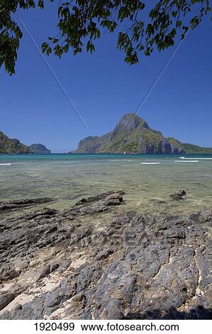 View Of Tropical Islands From El Nido; El Nido, Bacuit Archipelago, Palawan, Philippines View Large Photo Image Stock Photo - View Of Tropical Islands From El Nido; El Nido, Bacuit Archipelago, Palawan, Philippines. Fotosearch