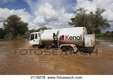 View of truck crossing river; Kenya View Large Photo Image Stock Photo - View of truck crossing river; Kenya. Fotosearch