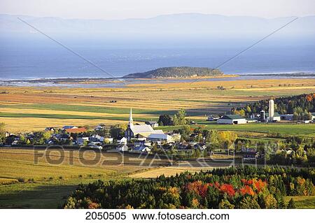 Stock Photography - View Of Village And St. Lawrence River At Sunrise, Kamouraska Village, Bas-Saint-Laurent Region, Quebec. Fotosearch