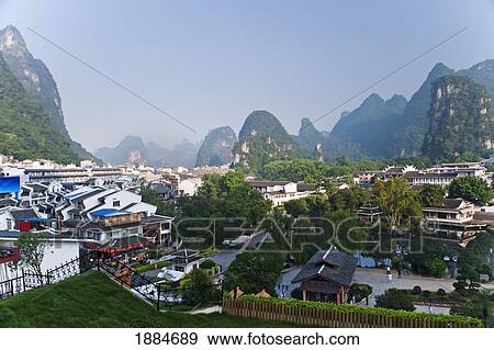 View Of Yangshuo With Karst Hills In The Background; Yangshuo, Guangxi, China View Large Photo Image Stock Photo - View Of Yangshuo With Karst Hills In The Background; Yangshuo, Guangxi, China. Fotosearch