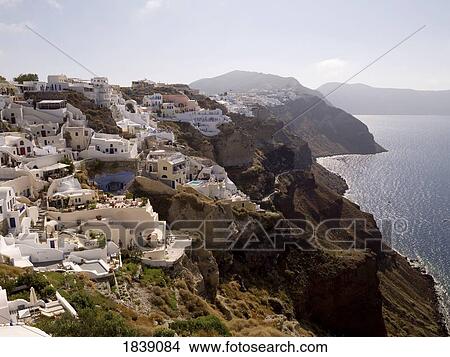 View On Oia And Fira Located On Cliff By Aegean Sea; Santorini, Greece View Large Photo Image Picture - View On Oia And Fira Located On Cliff By Aegean Sea; Santorini, Greece. Fotosearch