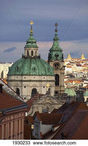 Stock Image - View over the Mala Strana District across Prague towards St Mikulas (Nicholas) Church, Czech Republic, Europe. Fotosearch