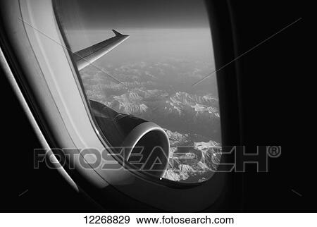 Stock Photo - View over Washington state from a commercial jet airliner window. Fotosearch
