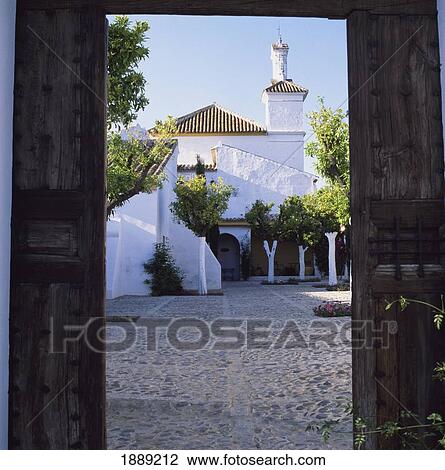 Stock Image - View Through A Doorway Into The Courtyard On The Hacienda Benazuza.. Fotosearch