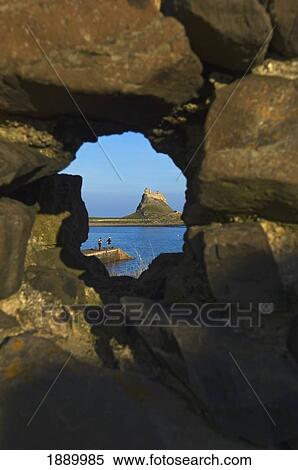 View Through A Hole In A Rock Wall To Lindisfarne Castle On Holy Island. View Large Photo Image Stock Photography - View Through A Hole In A Rock Wall To Lindisfarne Castle On Holy Island.. Fotosearch