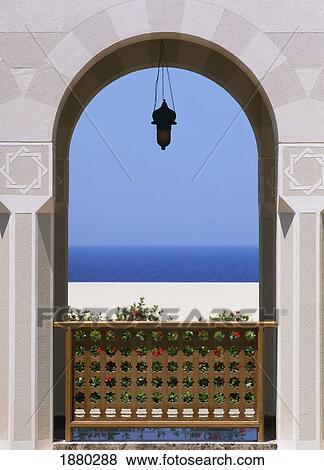 Stock Photo - View Through Archway To Beach And Sea. Fotosearch