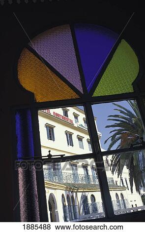 Stock Photo - View Through Colorful Arched Stained Glass Window. Fotosearch