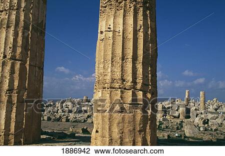 Stock Image - View Through Columns Of Ruined Greek Temple. Fotosearch