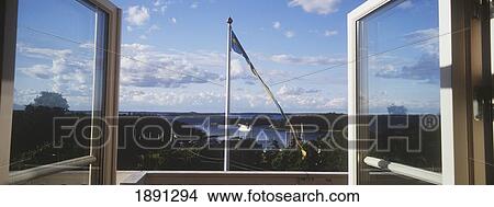 Picture - View Through Double Windows To A Swedish Flag And Across Uto Island.. Fotosearch