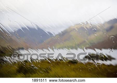 Stock Image - View Through Rain Splattered Windscreen At Wasdale. Fotosearch