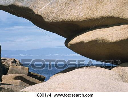 View Through Rock Formation With Yacht In The Distance View Large Photo Image Picture - View Through Rock Formation With Yacht In The Distance. Fotosearch
