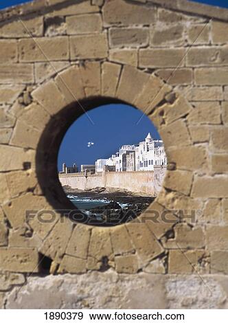 Stock Photo - View Through Round Window Of Ramparts. Fotosearch