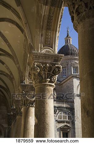 Stock Photo - View Through The Ornate Columns And Capitals Of Rectors Palace To The Cathedral.. Fotosearch