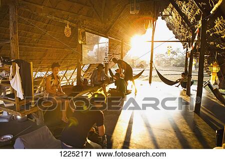 Stock Image - Views at sunset from a public hut just outside of the city with views of the rice fields and stunning scenery; Pai, Thailand. Fotosearch