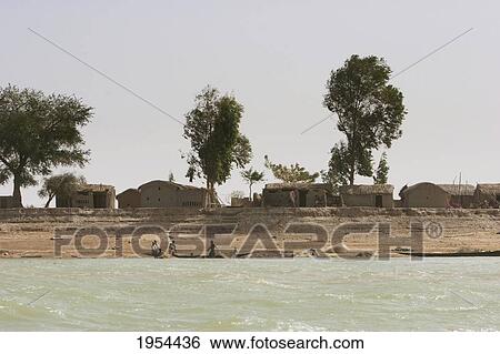Village along the shores of the Niger River between Mopti and Lake Debo, Mali View Large Photo Image Stock Photograph - Village along the shores of the Niger River between Mopti and Lake Debo, Mali. Fotosearch