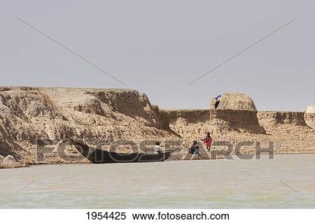 Stock Photography - Village along the shores of the Niger River between Mopti and Lake Debo, Mali. Fotosearch