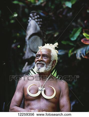 Stock Photograph - Village Chief conducting traditional sorcery ceremony; Ambrym Island, Vanuatu. Fotosearch