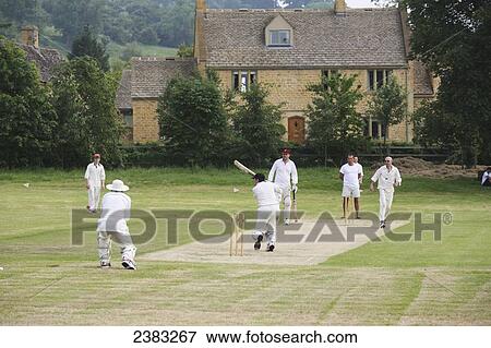 Stock Photo - Village cricket match near Stanton village; Gloucestershire, England. Fotosearch