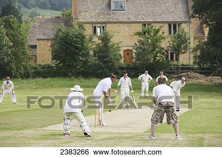 Stock Photograph - Village cricket match near Stanton village; Gloucestershire, England. Fotosearch