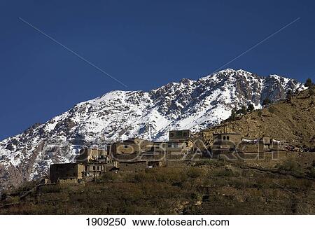 Village In Atlas Mountains With Snowcapped In Background, Atlas Mountain, Morocco View Large Photo Image Stock Image - Village In Atlas Mountains With Snowcapped In Background, Atlas Mountain, Morocco. Fotosearch