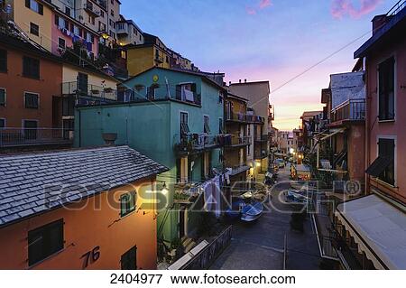 Stock Photo - Village of Manarola at sunset, Cinque Terre; Manarola, Liguria, Italy. Fotosearch