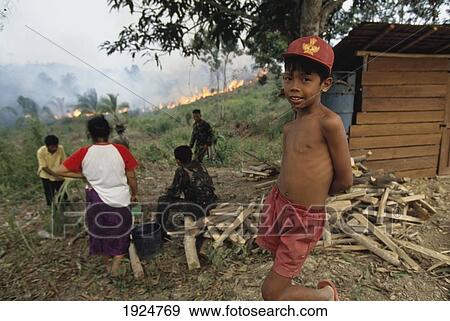 Stock Photo - Villagers Look On As Fire Approaches. Fotosearch