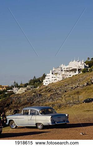 Vintage Car And Views Of Casa Pueblo, Original Costruction By Painter Carlos Paez Vilaro, Punta Del Este, Uruguay, South America View Large Photo Image Stock Photography - Vintage Car And Views Of Casa Pueblo, Original Costruction By Painter Carlos Paez Vilaro, Punta Del Este, Uruguay, South America. Fotosearch