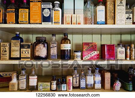 Stock Image - Vintage medicinal items on shelf in Kilby General Store Museum at Kilby Historic Site; Harrison Mills, British Columbia, Canada. Fotosearch