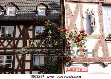 Stock Photo - Virgin And Child Statue On A Half-Timbered House On The Kirschgarten, Mainz, Germany. Fotosearch
