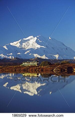 Stock Photo - Visitor Bus Passes Along Tundra Pond With Reflection Of Mount Mckinley; Alaska, Usa. Fotosearch