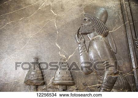 Visitor covering mouth in front of two incense burners, relief from Audience Hall of Darius I at Persepolis, National Museum of Iran; Tehran, Iran View Large Photo Image Picture - Visitor covering mouth in front of two incense burners, relief from Audience Hall of Darius I at Persepolis, National Museum of Iran; Tehran, Iran. Fotosearch