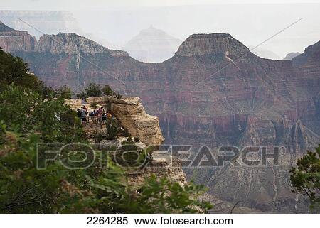Visitors looking over north rim of grand canyon; kanab arizona usa View Large Photo Image Stock Photography - Visitors looking over north rim of grand canyon; kanab arizona usa. Fotosearch